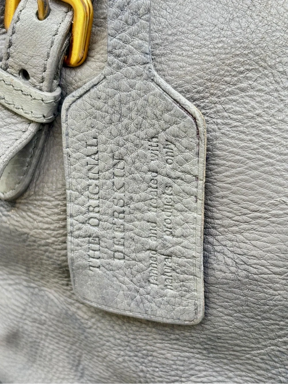 AUTHENTIC PRADA GUNMETAL & SHEEN DEERSKIN LEATHER SHOULDER BAG W/LUGGAGE TAG.